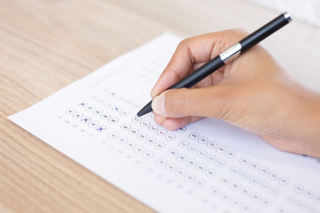 closeup-person-filling-out-questionary-form